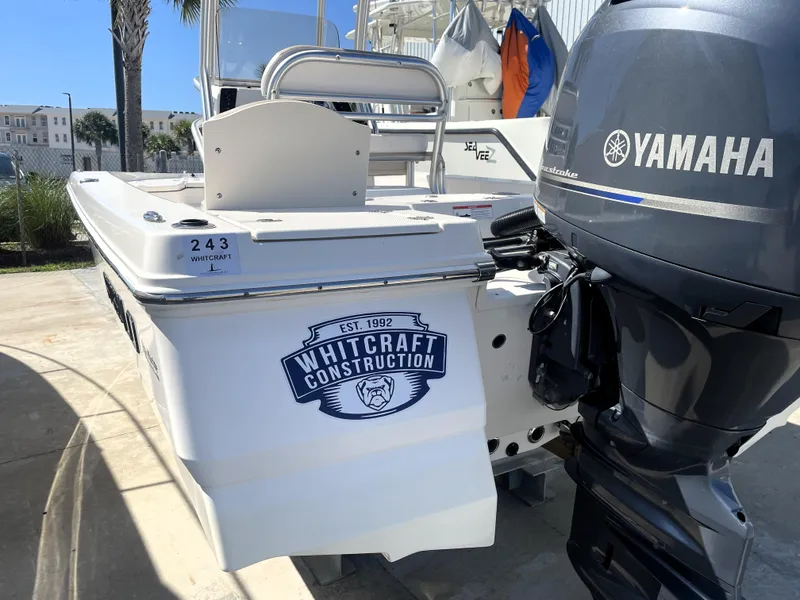 Slide: The Image of 2018 Robalo 206 Cayman boat with Yamaha outboard motor and Whitcraft Construction logo. - 10