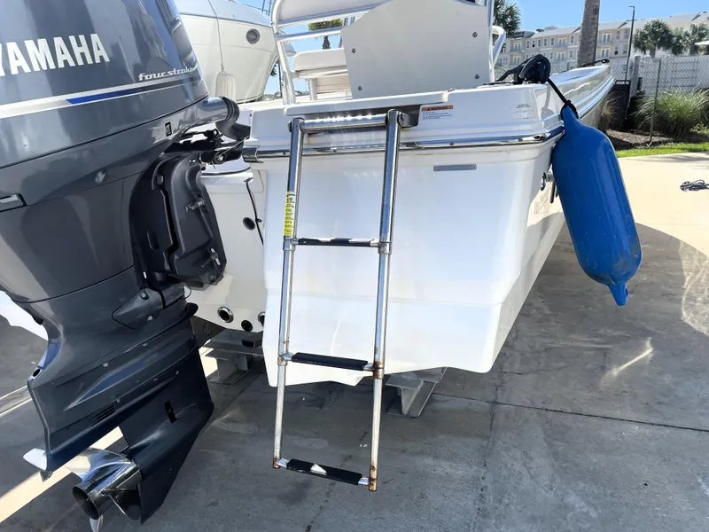 Slide: The Image of 2018 Robalo 206 Cayman boat with Yamaha outboard motor and boarding ladder. - 11