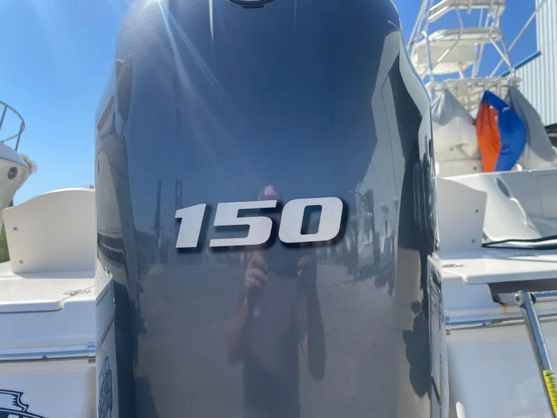 Slide: The Image of 2018 Robalo 206 Cayman boat with a 150 horsepower engine. - 13