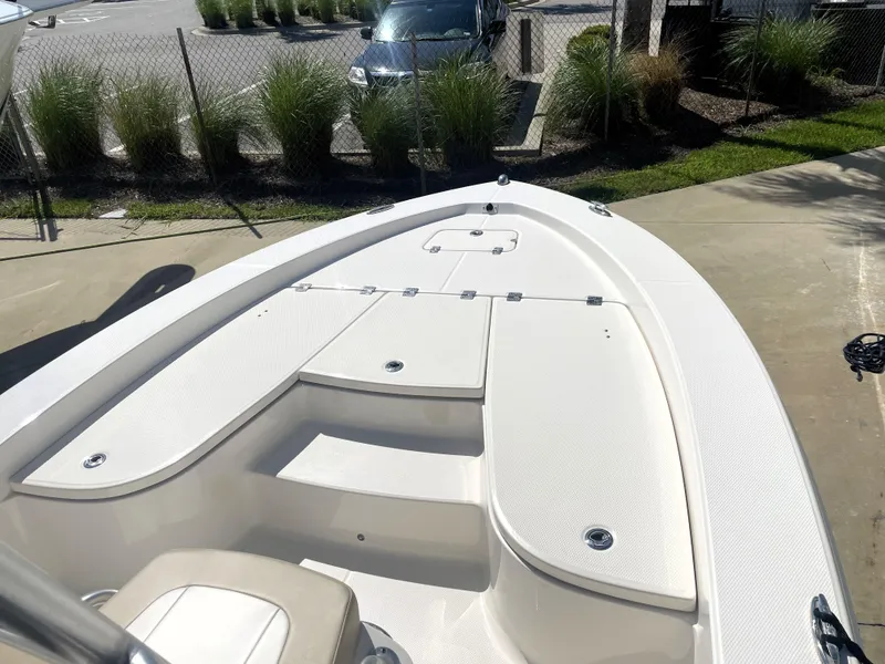 Slide: The Image of 2018 Robalo 206 Cayman boat deck with storage compartments. - 19