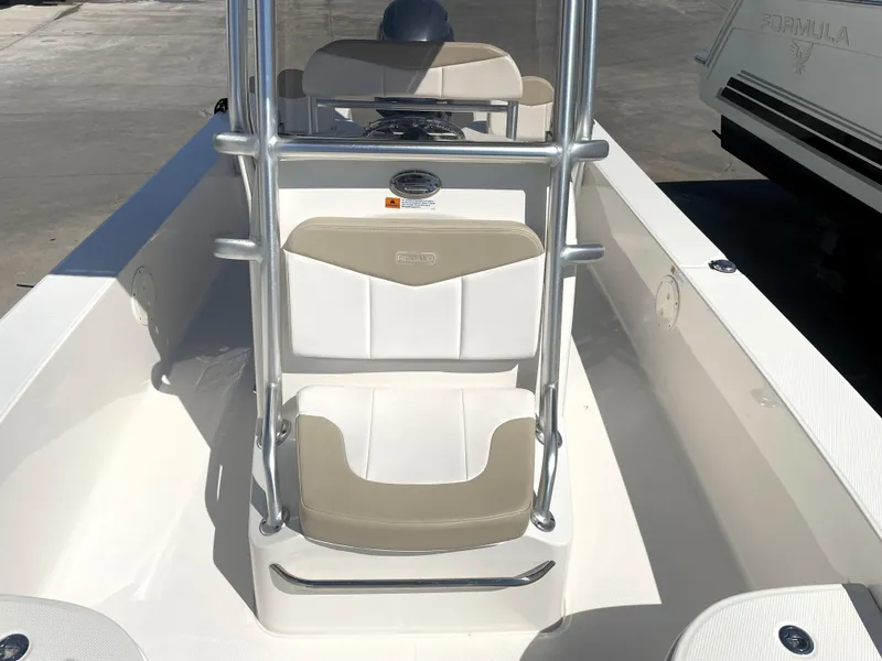Slide: The Image of 2018 Robalo 206 Cayman boat interior with beige and white seating. - 23