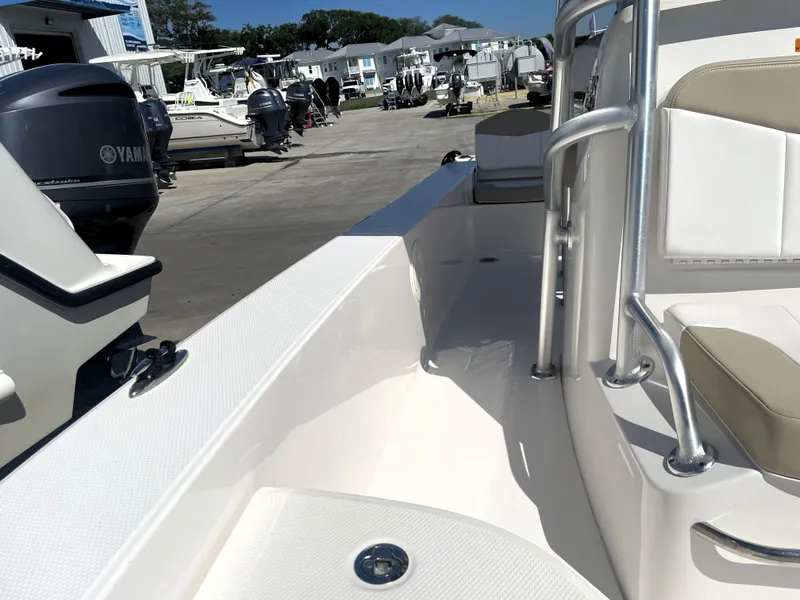Slide: The Image of 2018 Robalo 206 Cayman boat interior with Yamaha outboard engines in marina. - 26