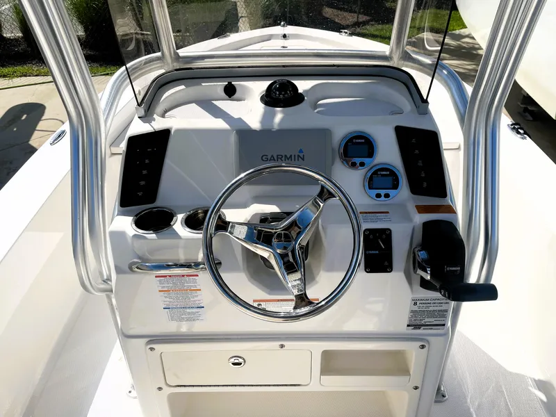 Slide: The Image of 2018 Robalo 206 Cayman boat console with Garmin navigation system and steering wheel. - 28