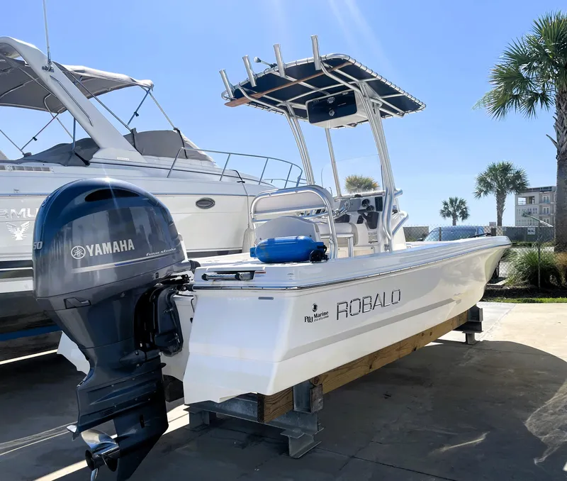 Slide: The Image of 2018 Robalo 206 Cayman boat with Yamaha outboard motor on a sunny day. - 3