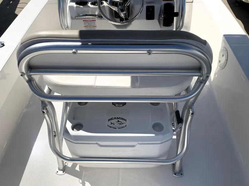 Slide: The Image of 2018 Robalo 206 Cayman boat interior with seating and cooler. - 42