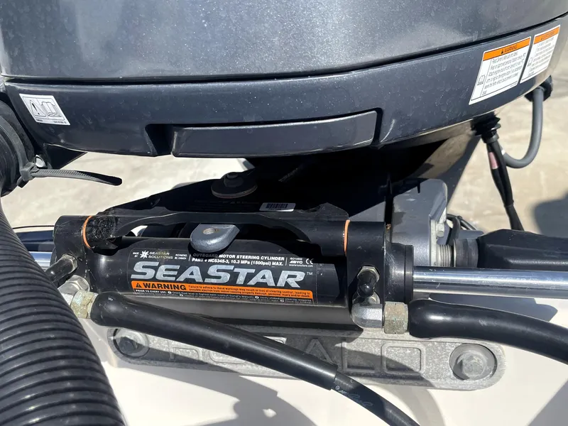 Slide: The Image of Close-up of SeaStar hydraulic steering on a 2018 Robalo 206 Cayman boat. - 43