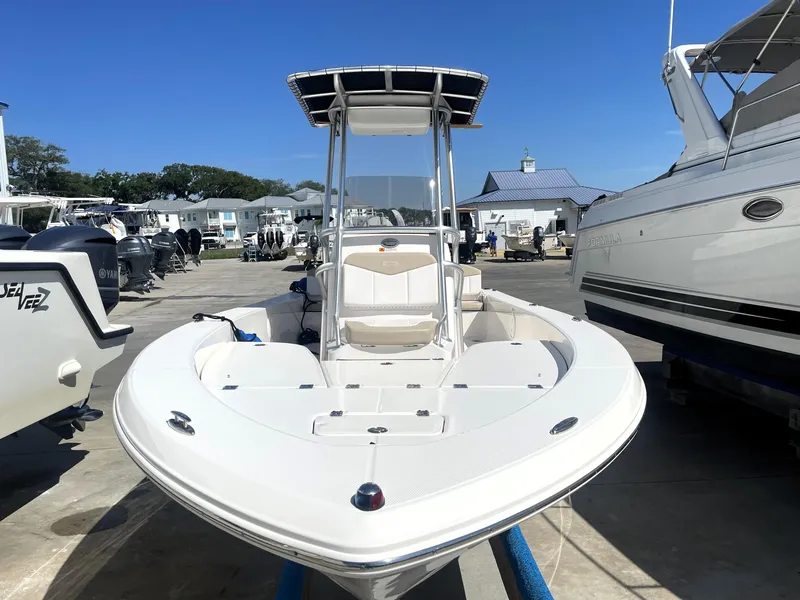 Slide: The Image of 2018 Robalo 206 Cayman boat at a marina, front view. - 6