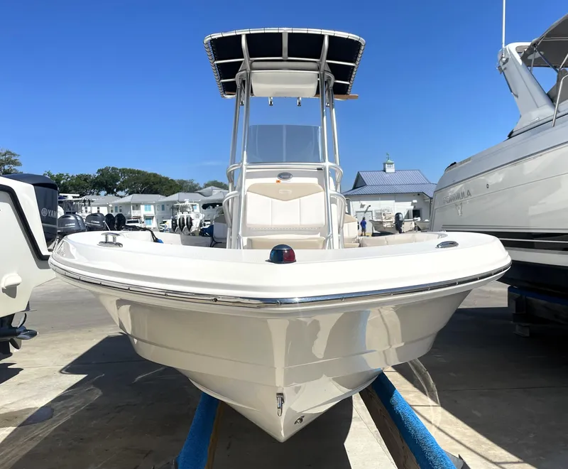 Slide: The Image of 2018 Robalo 206 Cayman boat on display at a marina. - 7