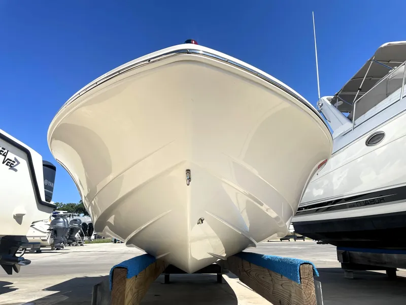 Slide: The Image of 2018 Robalo 206 Cayman boat on dry dock, front view. - 8