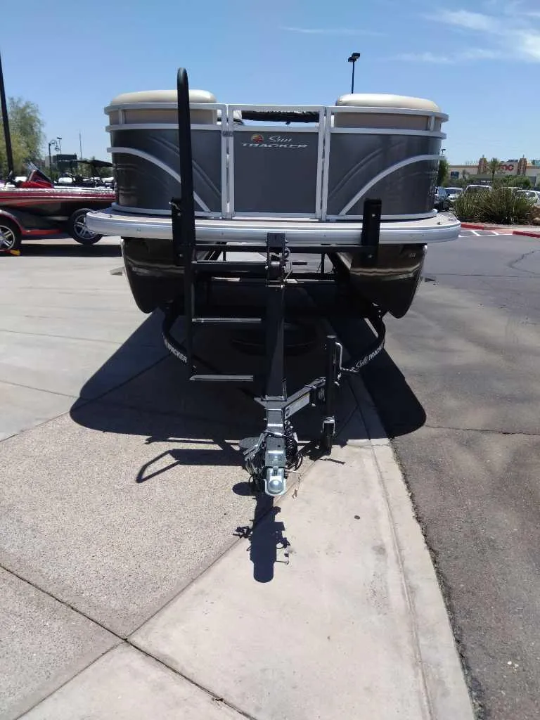 Slide: The Image of 2024 Sun Tracker Party Barge 20 DLX pontoon boat on a trailer. - 3