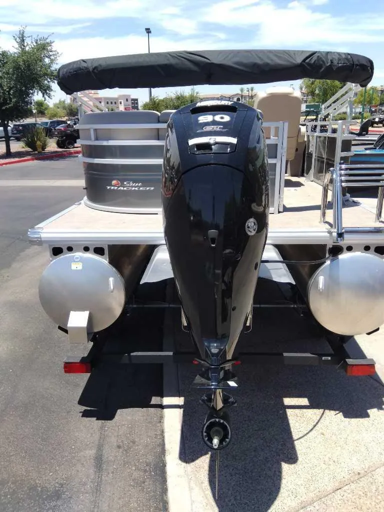 Slide: The Image of 2024 Sun Tracker Party Barge 20 DLX pontoon boat with outboard motor. - 4