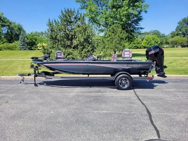 Slide: The Image of 2024 Ranger RT188P fishing boat on trailer, parked outdoors. - 0