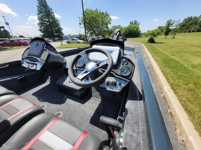 Slide: The Image of 2024 Ranger RT188P boat interior with steering wheel and dashboard controls. - 4