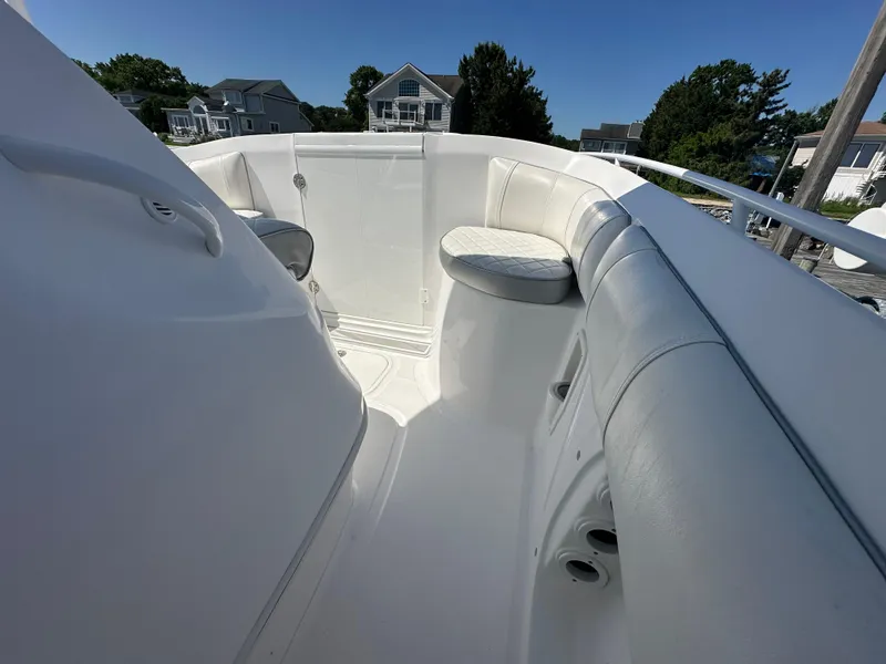 Slide: The Image of 2020 Glasstream 280 SCX boat interior with white cushioned seating and sleek design. - 19