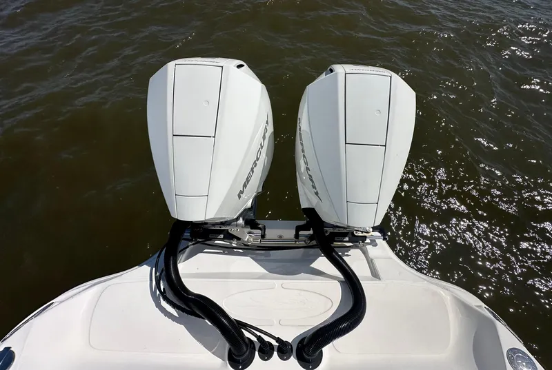 Slide: The Image of 2020 Glasstream 280 SCX boat with twin Mercury outboard engines on water. - 2