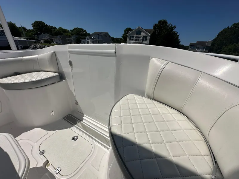 Slide: The Image of Interior seating of 2020 Glasstream 280 SCX boat with white quilted upholstery. - 20