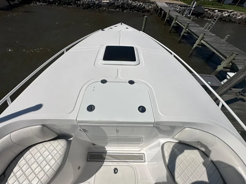 Slide: The Image of 2020 Glasstream 280 SCX boat bow with seating and storage compartments. - 21