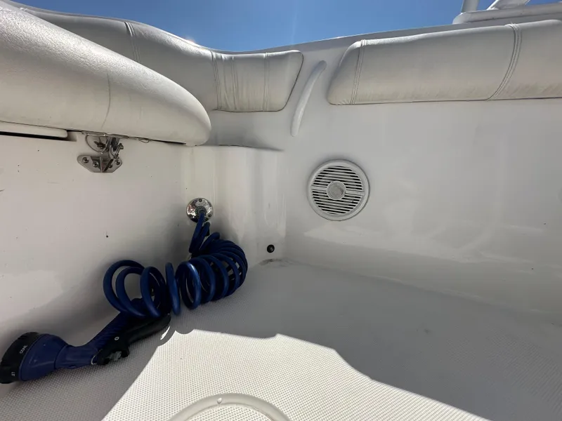 Slide: The Image of Interior of 2020 Glasstream 280 SCX boat with coiled blue hose and speaker. - 24