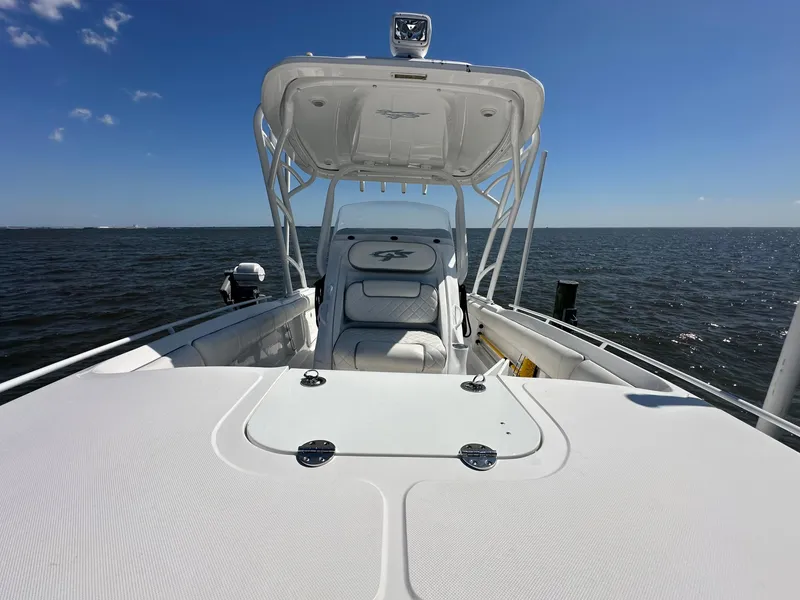Slide: The Image of 2020 Glasstream 280 SCX boat on open water under clear blue sky. - 26