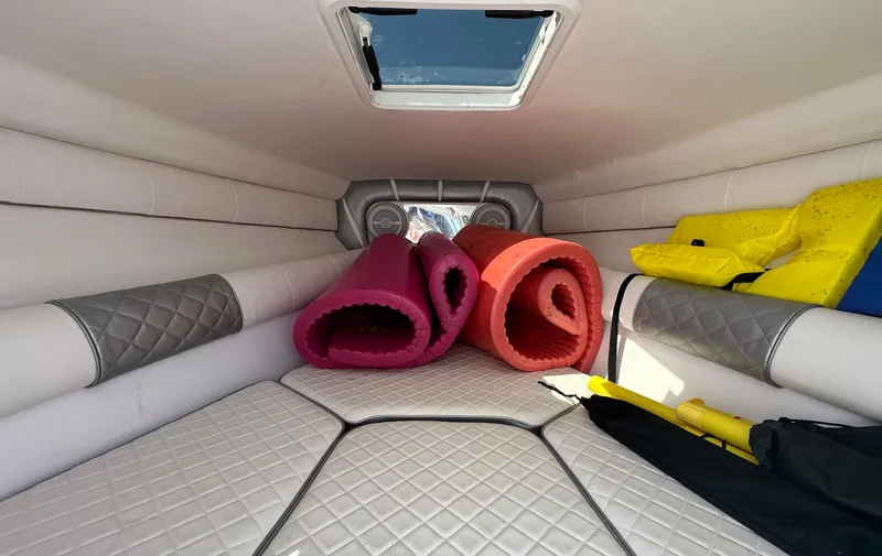 Slide: The Image of Interior cabin of 2020 Glasstream 280 SCX with rolled mats and life jackets. - 29