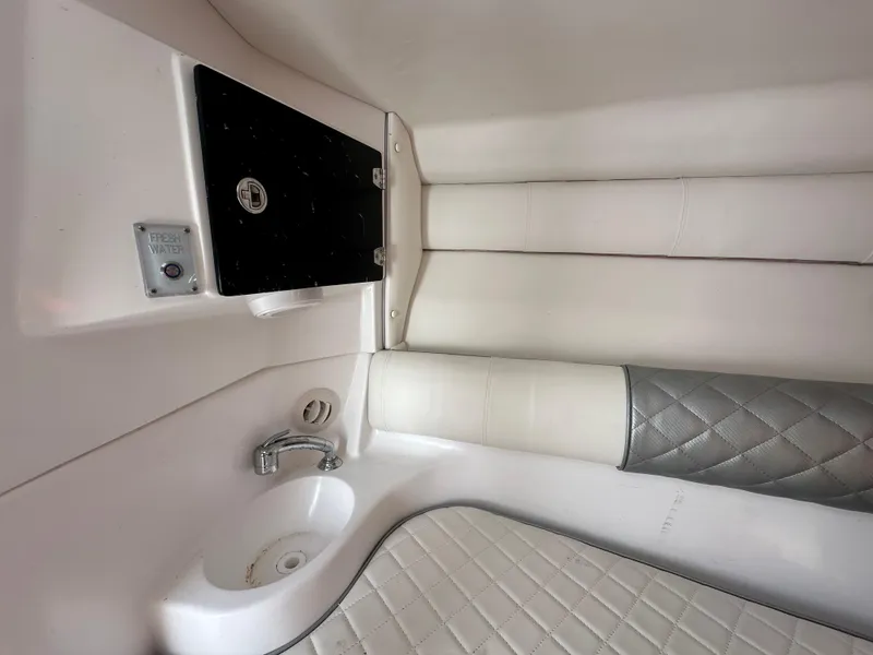 Slide: The Image of Interior of 2020 Glasstream 280 SCX boat with sink and cushioned seating. - 30