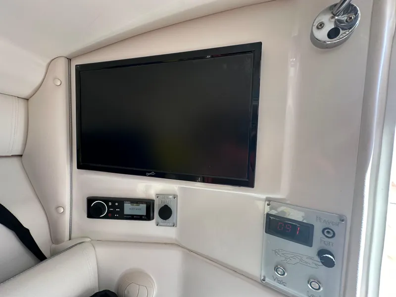 Slide: The Image of Entertainment and control panel inside a 2020 Glasstream 280 SCX boat. - 32