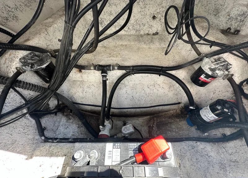 Slide: The Image of Engine compartment of a 2020 Glasstream 280 SCX boat with wiring and components. - 36