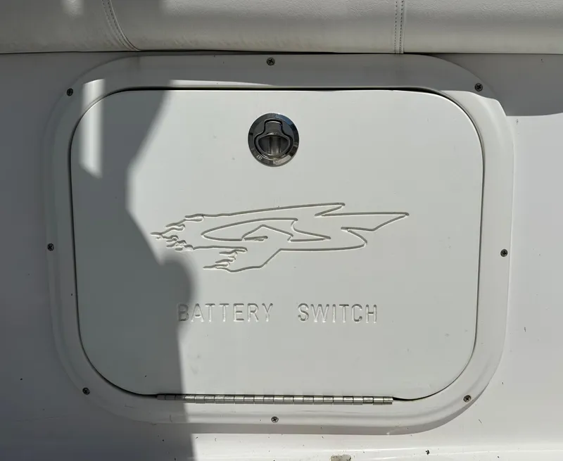 Slide: The Image of 2020 Glasstream 280 SCX battery switch compartment with logo. - 37