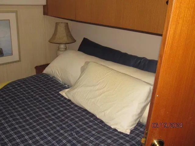 Slide: The Image of Cozy bedroom in a 2004 Ocean Yachts Super Sport boat. - 18