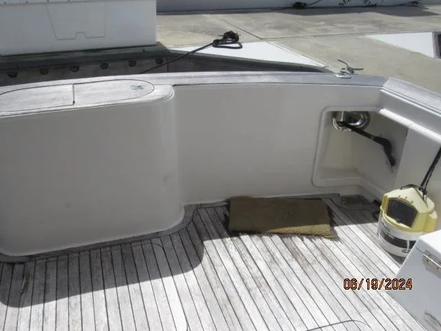 Slide: The Image of 2004 Ocean Yachts Super Sport boat deck with storage and cleaning equipment. - 3