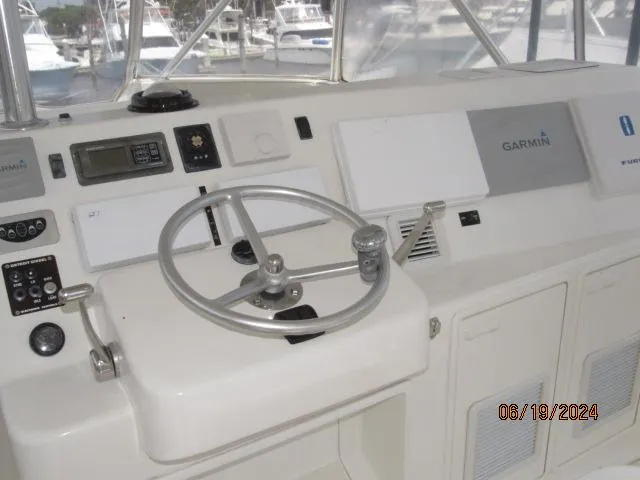 Slide: The Image of 2004 Ocean Yachts Super Sport helm with Garmin navigation system. - 5