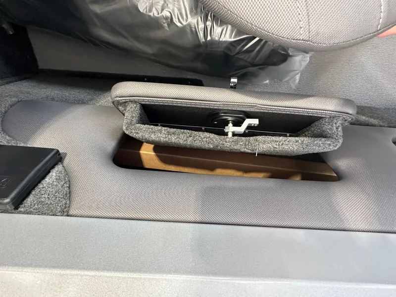 Slide: The Image of 2024 Smoker Craft Ultima 182 boat storage compartment with latch. - 11