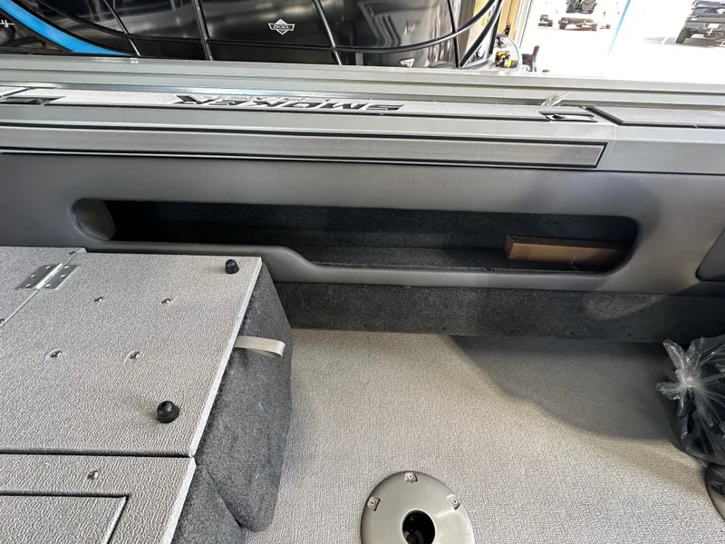 Slide: The Image of 2024 Smoker Craft Ultima 182 interior storage compartment and deck. - 15