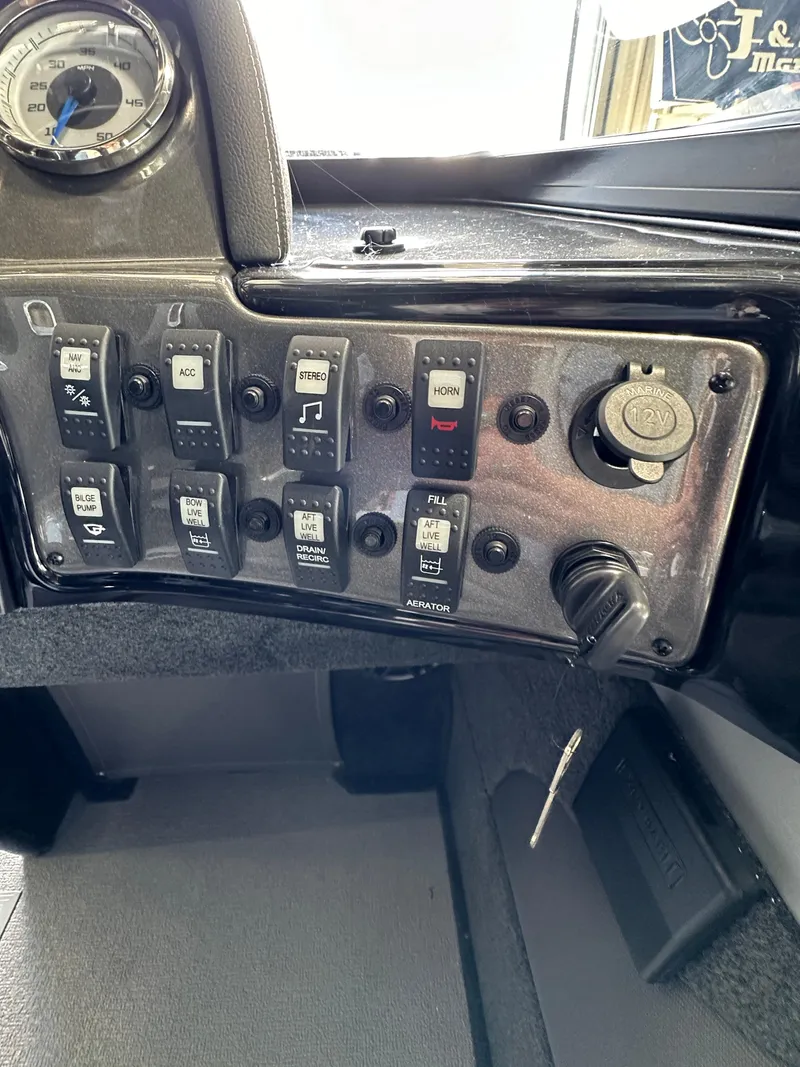 Slide: The Image of Control panel of a 2024 Smoker Craft Ultima 182 boat. - 17