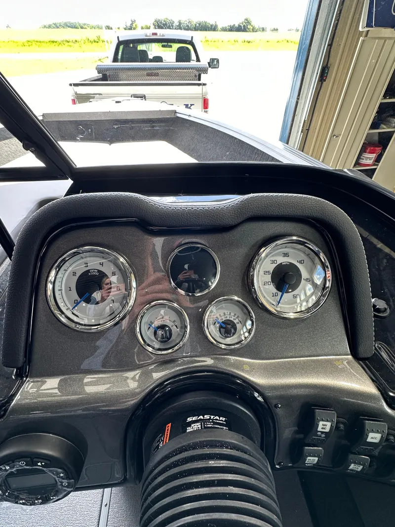 Slide: The Image of 2024 Smoker Craft Ultima 182 dashboard with gauges and controls. - 18