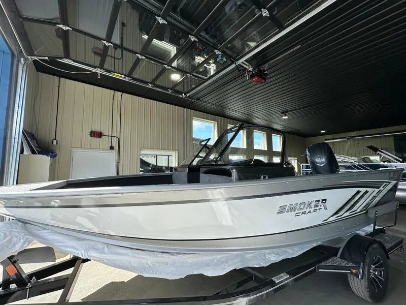 Slide: The Image of 2024 Smoker Craft Ultima 182 boat in showroom. - 2