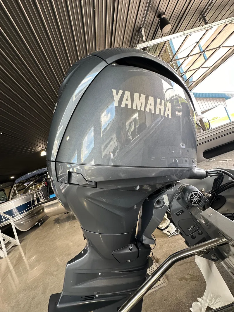 Slide: The Image of 2024 Smoker Craft Ultima 182 with Yamaha outboard motor in showroom. - 23