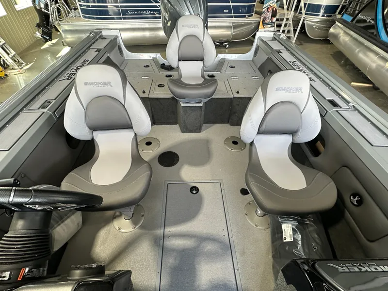 Slide: The Image of 2024 Smoker Craft Ultima 182 boat interior with three seats and storage compartments. - 3