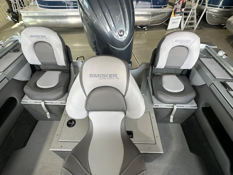 Slide: The Image of 2024 Smoker Craft Ultima 182 boat interior with three grey and white seats. - 4
