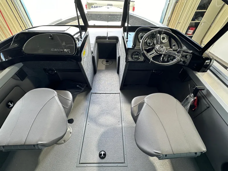 Slide: The Image of 2024 Smoker Craft Ultima 182 boat interior with dual seats and steering console. - 5