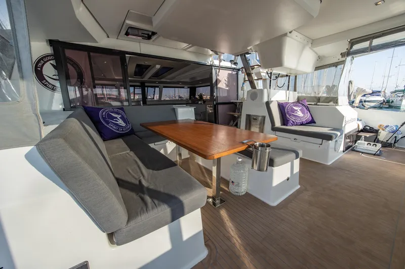 Slide: The Image of 2023 Fountaine Pajot Tanna 47 yacht interior with seating and table. - 11
