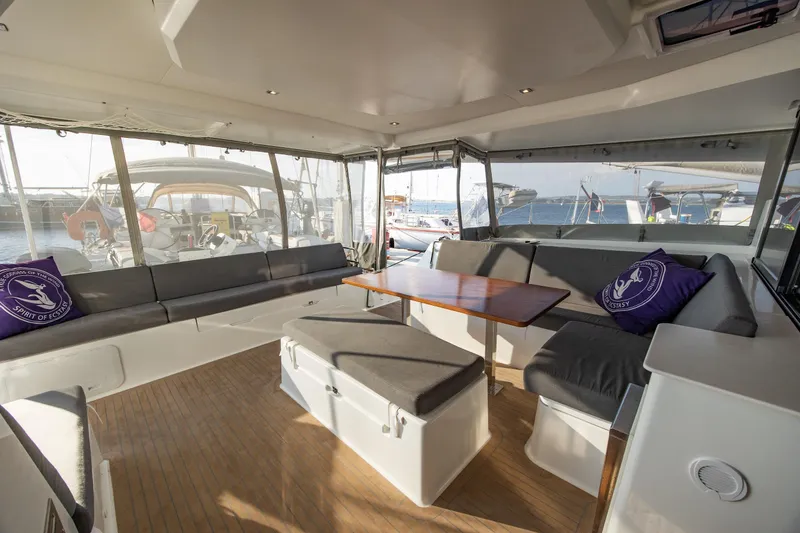 Slide: The Image of Spacious interior of 2023 Fountaine Pajot Tanna 47 catamaran with modern seating and table. - 12