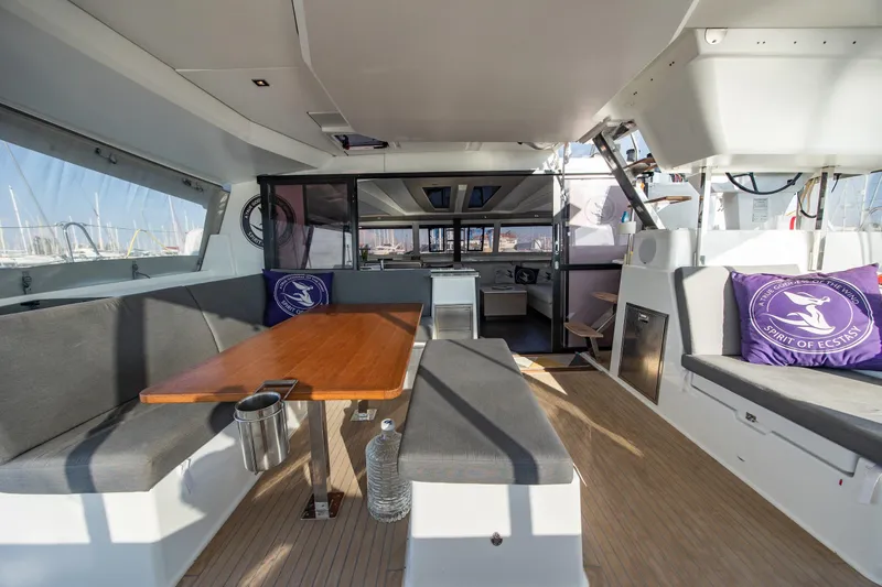 Slide: The Image of Spacious interior of 2023 Fountaine Pajot Tanna 47 catamaran with modern seating and dining area. - 16