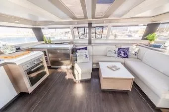 Slide: The Image of Luxurious interior of 2023 Fountaine Pajot Tanna 47 yacht with modern kitchen and seating area. - 20