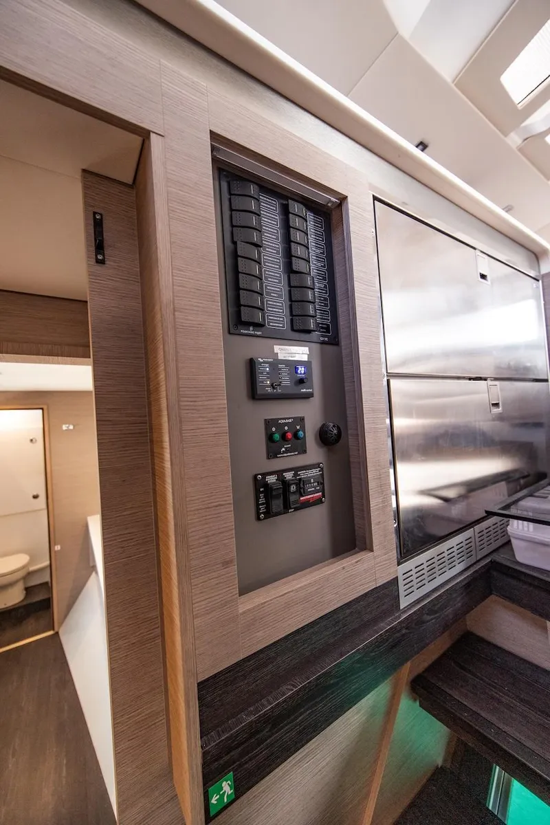Slide: The Image of Interior control panel of 2023 Fountaine Pajot Tanna 47 yacht, featuring modern design elements. - 30