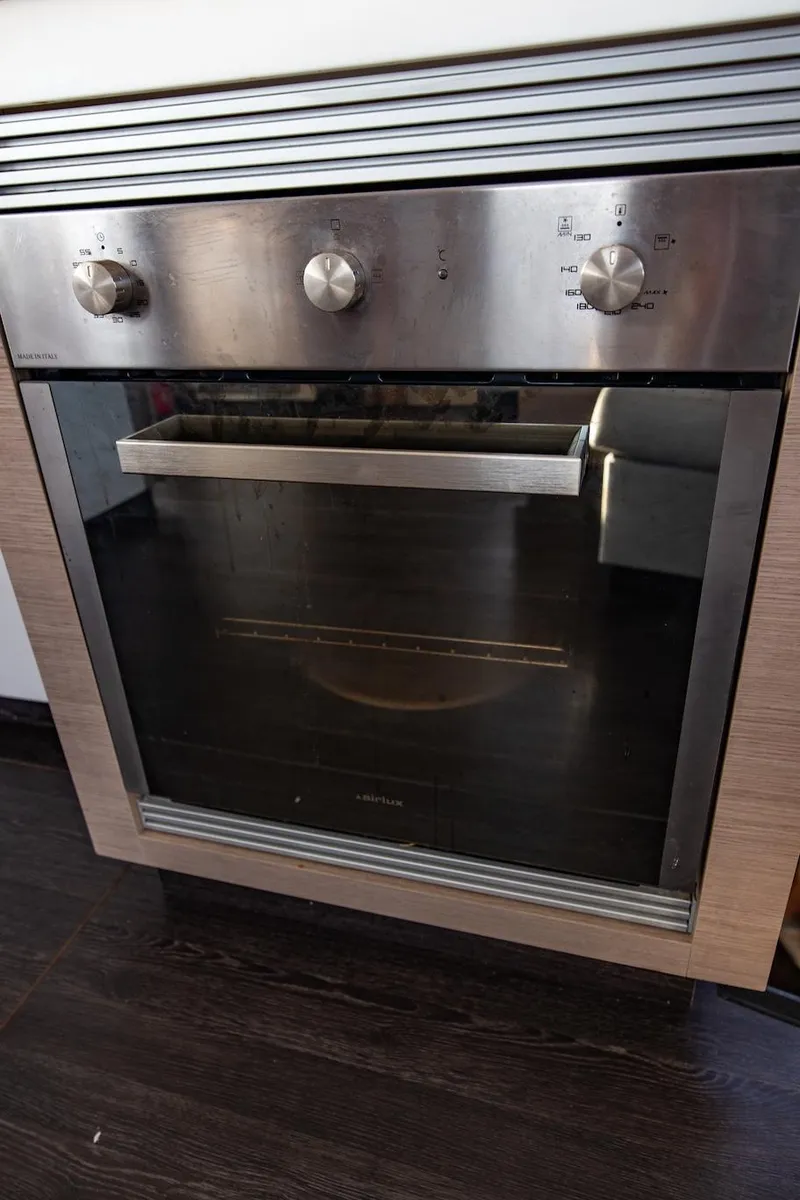 Slide: The Image of Stainless steel oven in 2023 Fountaine Pajot Tanna 47 yacht kitchen. - 31