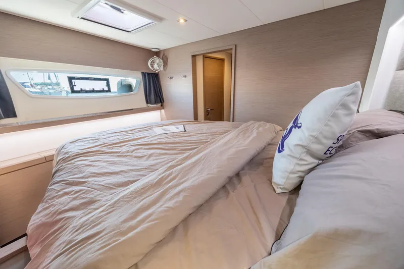 Slide: The Image of Luxurious bedroom interior of 2023 Fountaine Pajot Tanna 47 yacht with cozy bedding. - 50