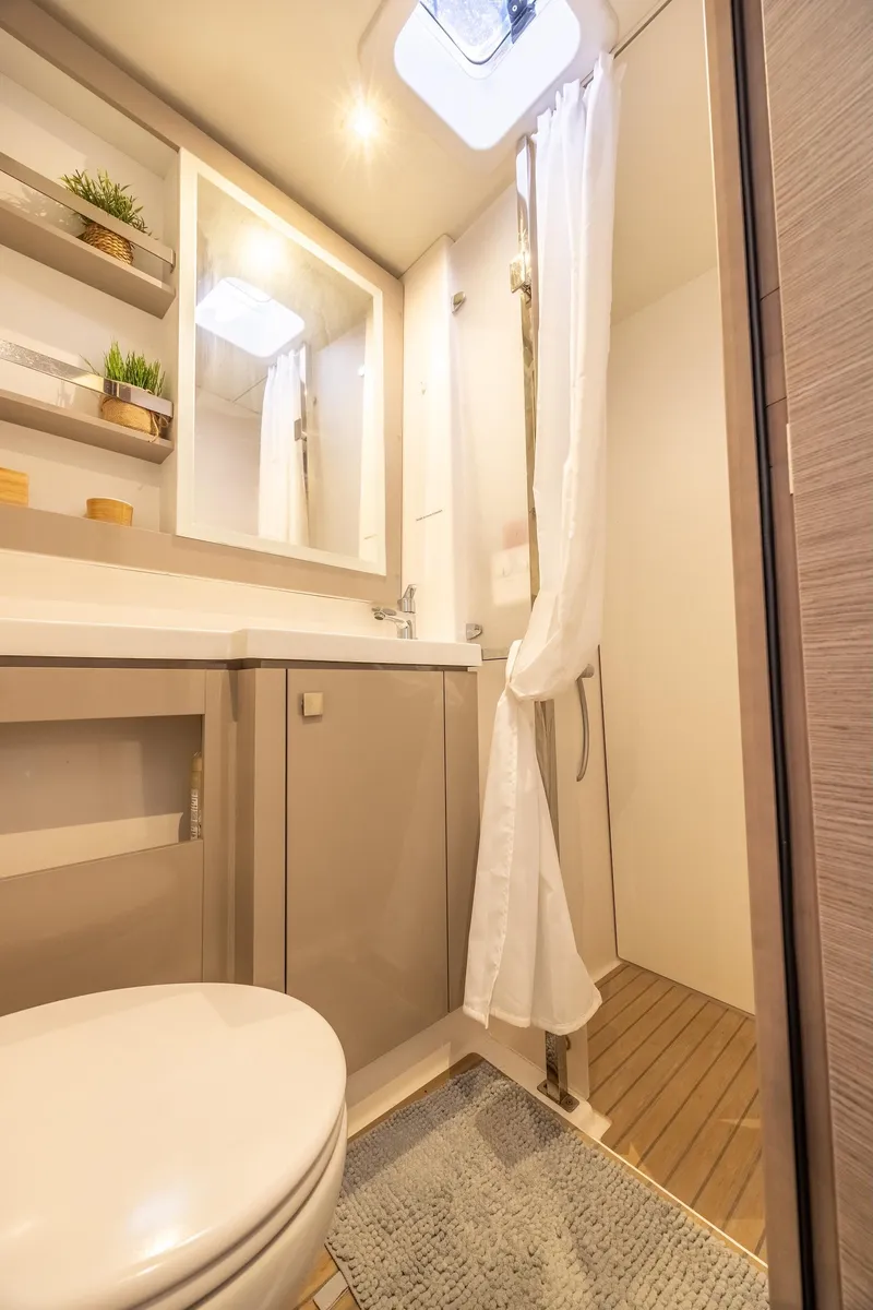 Slide: The Image of Modern bathroom in 2023 Fountaine Pajot Tanna 47 yacht, featuring sleek design and natural light. - 52