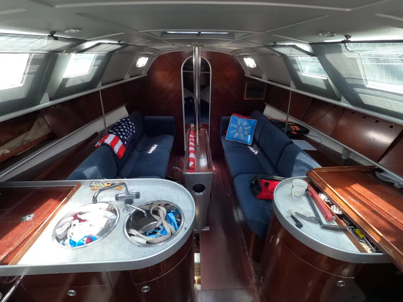 Slide: The Image of Interior of a 1992 Beneteau First 35s5 yacht with elegant furnishings. - 11