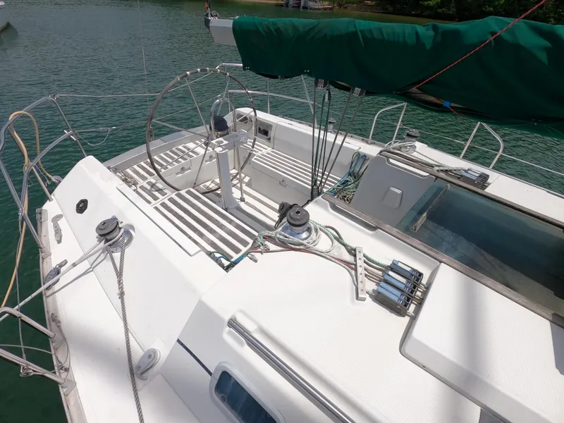 Slide: The Image of Beneteau First 35s5 sailboat deck, 1992 model, with green sail. - 3